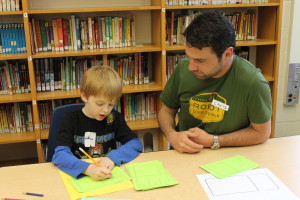 chris with student at family write night